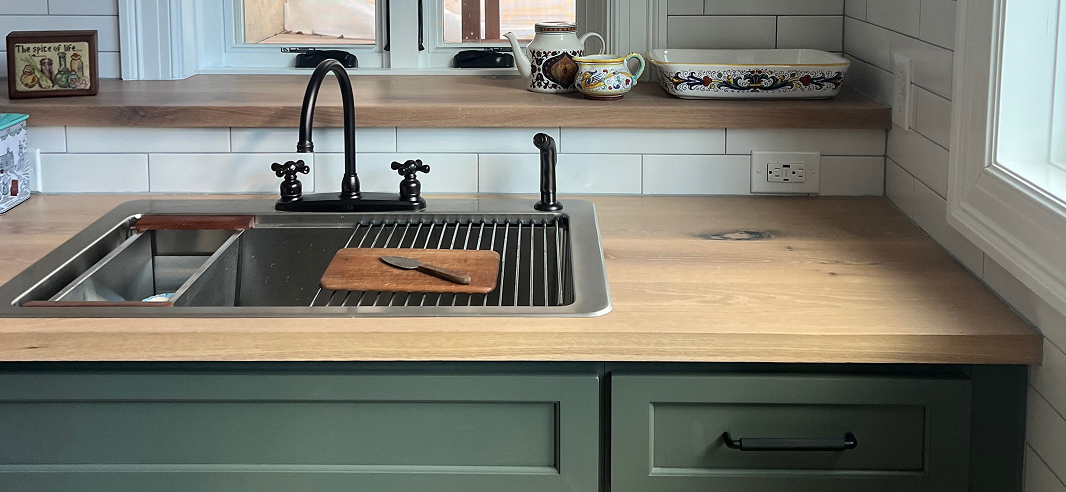 Character white oak kitchen countertop with integrated sink and visible grain variation