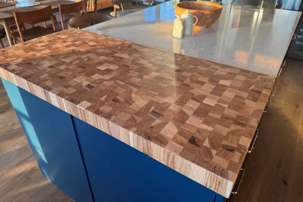 Close-up of a Calico Hickory end-grain countertop with natural sapwood contrast and tung oil finish.