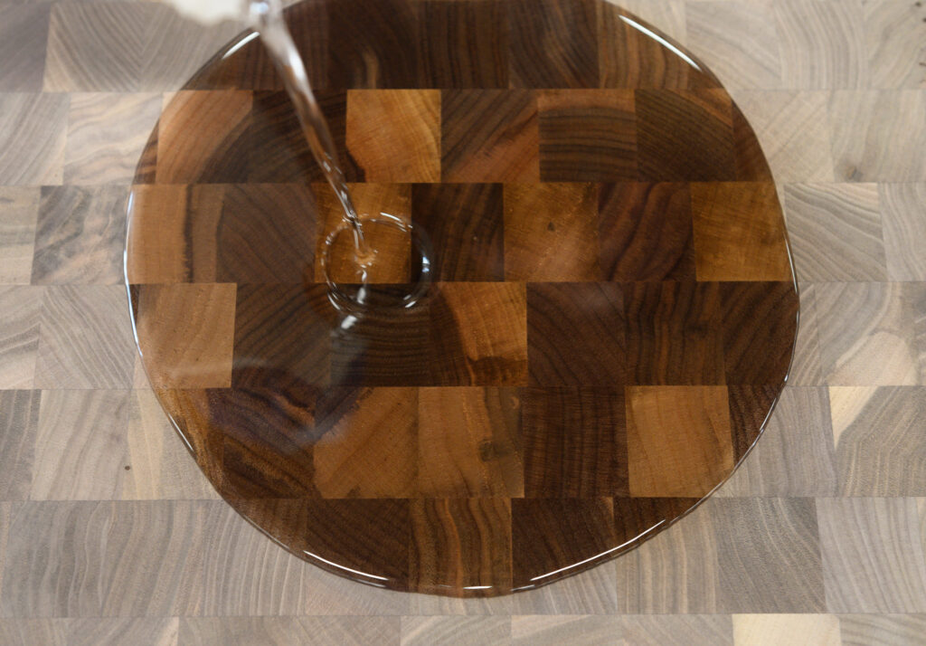 Initial oil application on walnut end grain butcher block surface
