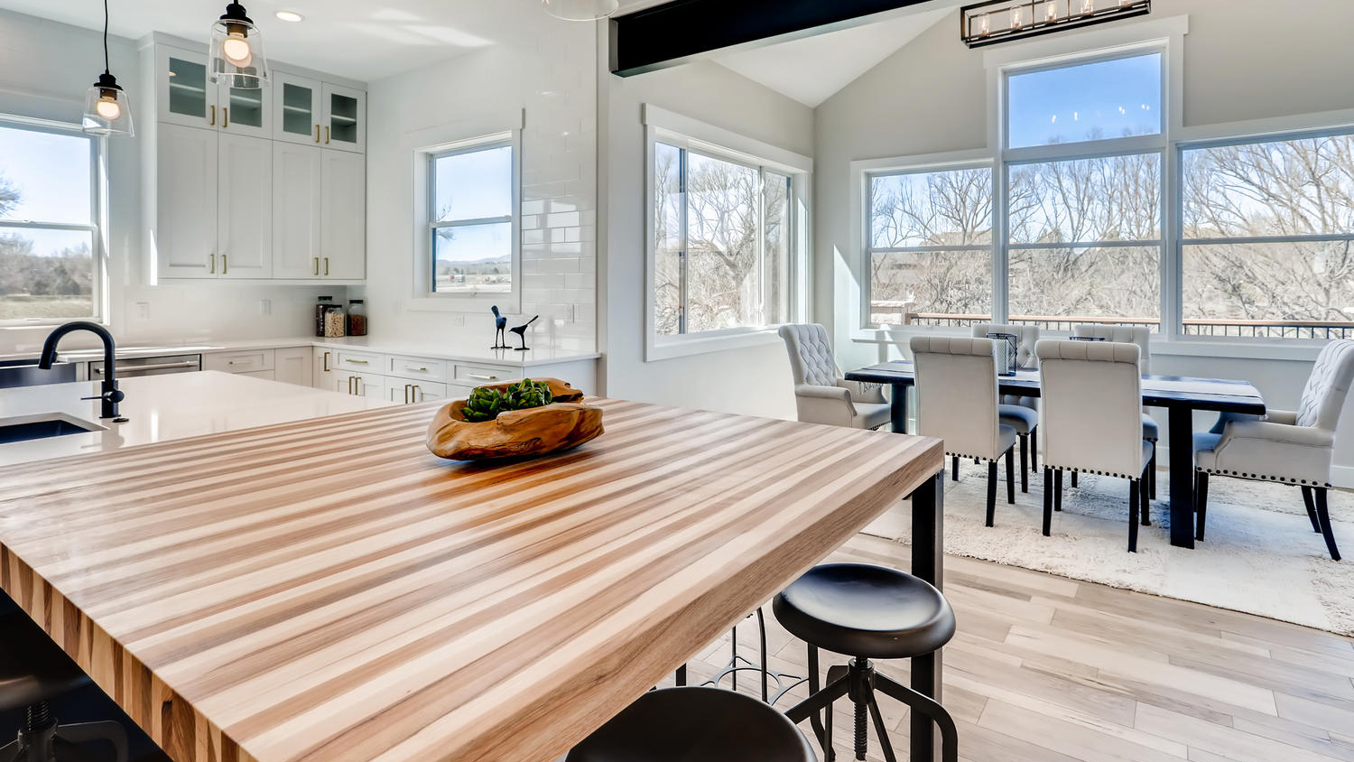 Calico hickory butcher block dining extension with the formal dining room beyond