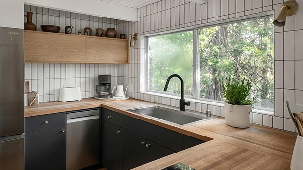 White oak edge grain butcher block countertop with undermount sink, continuous run around inside corner